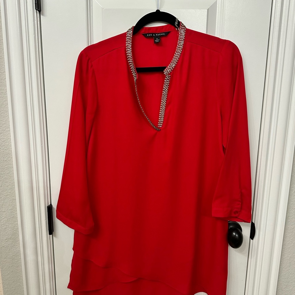 Red tunic with gemstone collar